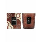 Two patterned Voluspa Forbidden Fig candles in decorative containers
