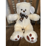 White teddy bear with a brown paw-print ribbon
