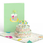 Birthday pop-up card with a tiered cake and colorful confetti