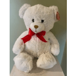 White teddy bear with a red ribbon bow