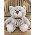 Plush teddy bear with a plaid ribbon bow