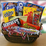 Basket filled with assorted candy bars and snack packs