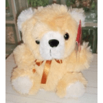 Plush teddy bear with a ribbon bow