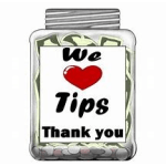 Clear jar labeled "We ♥ Tips Thank you" filled with folded bills and coins