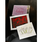 Three greeting cards, including a birthday card and floral designs