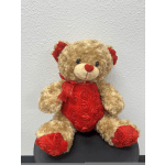 Teddy bear with red rose accents and a red ribbon bow