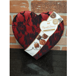 Heart-shaped box of assorted chocolates with red and black floral pattern