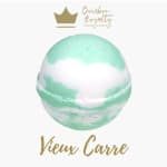 Mint and white bath bomb with a candle company logo