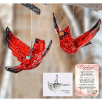 Two red glass cardinal ornaments hang by strings.