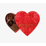 Red heart-shaped chocolate box partially open to show assorted chocolates inside.