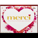 Heart-shaped box of Merci chocolates with pink and red graphics
