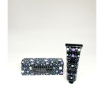 Floral-patterned hand cream tube with matching rectangular box on a white background