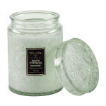 Green glass candle jar with a matching lid