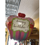 Pink birthday balloon with polka dots and a heart topper