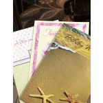 Stack of colorful greeting cards with birthday and thank-you designs