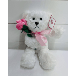 White plush teddy bear holding a pink fabric rose with a pink ribbon and gift tag