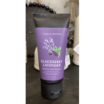 Purple blackberry lavender hand cream tube on a dark surface