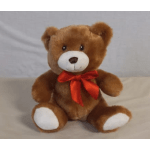 Brown teddy bear with a red ribbon bow
