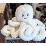 White plush octopus toy with a smiling face