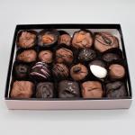 Box of assorted chocolate truffles in paper cups
