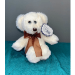 White teddy bear with a brown ribbon and tag