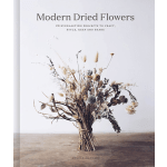 Dried flower bouquet in a tied bundle with beige, white, and blue accents