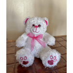 White teddy bear with pink bow and glittery paw pads