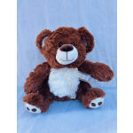 Brown teddy bear with a white belly and ribbon bow