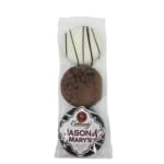 Wrapped gift set with two round items and a Jason & Mary's label