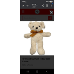 Cream teddy bear with a gold ribbon bow