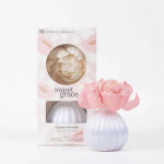 Pink flower-shaped diffuser bottle with packaging box