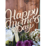 Wooden Happy Mother's Day sign above a floral arrangement with white calla lilies and purple blooms