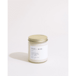 Jar candle with a gold lid and white label