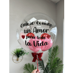 Clear balloon with pink balloons and Spanish love message