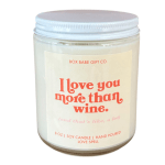 Soy candle in a glass jar with a white lid and pink label text