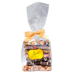 Bag of assorted chocolate-covered treats with sprinkles in clear wrap tied with a gold bow