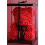 Red rose teddy bear in a clear gift box with a birthday ribbon