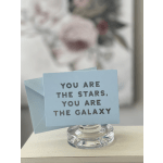 Blue greeting card in a glass holder with a matching envelope