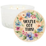 White candle with a floral lid label reading "you've got this!"