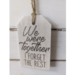 Wooden hanging sign with the words "We were together... I forget the rest."