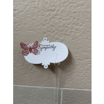 White sympathy sign with a pink butterfly on a clear stake