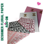 Stack of designer paper sheets with Chanel and Dior logos