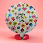 Round birthday balloon with colorful flower prints and "Happy Birth Day!" text