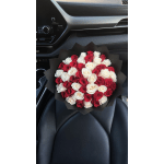 Bouquet of red and white roses wrapped in black paper