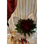 Bouquet of red roses with a teddy bear and heart balloon
