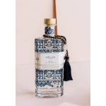 Decorative bath product bottle with a tassel and beaded charm