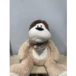 Large plush monkey with a small floral accent on its chest