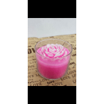 Pink candle in a clear glass cup with a flower-shaped top