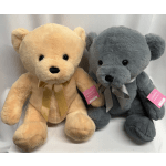 Two plush teddy bears with ribbon bows, one beige and one gray
