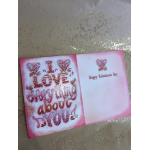 Valentine's Day greeting card with pink hearts and the words "I love everything about you"